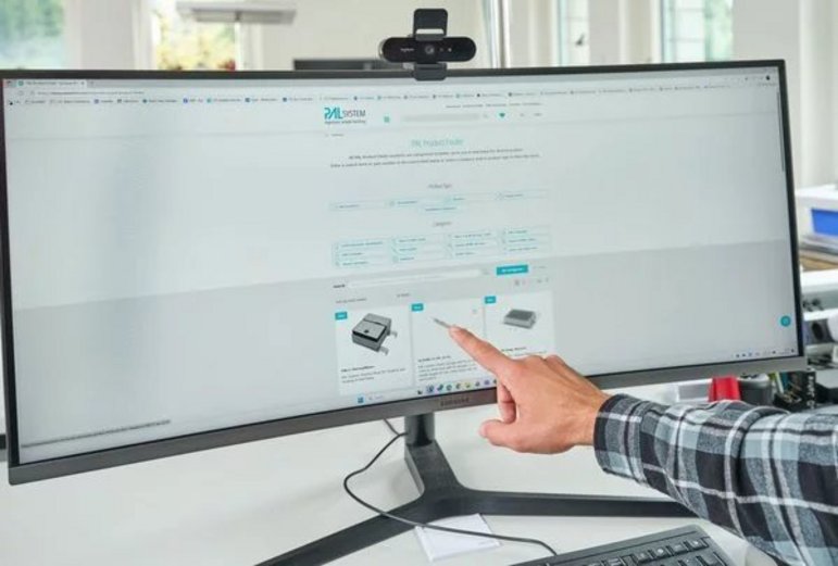 Hand pointing at options on a computer screen while using the PAL Product Finder tool